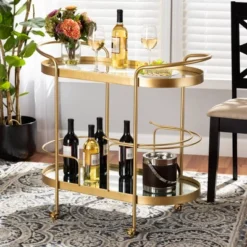 Kamal Glam Brushed Metal And Mirrored Glass 2 Tier Mobile Wine Bar Cart Gold - Baxton Studio -Urban Dwell Gear Outlet Store GUEST 034e04a5 db63 474b 9d05 6c159816da1c